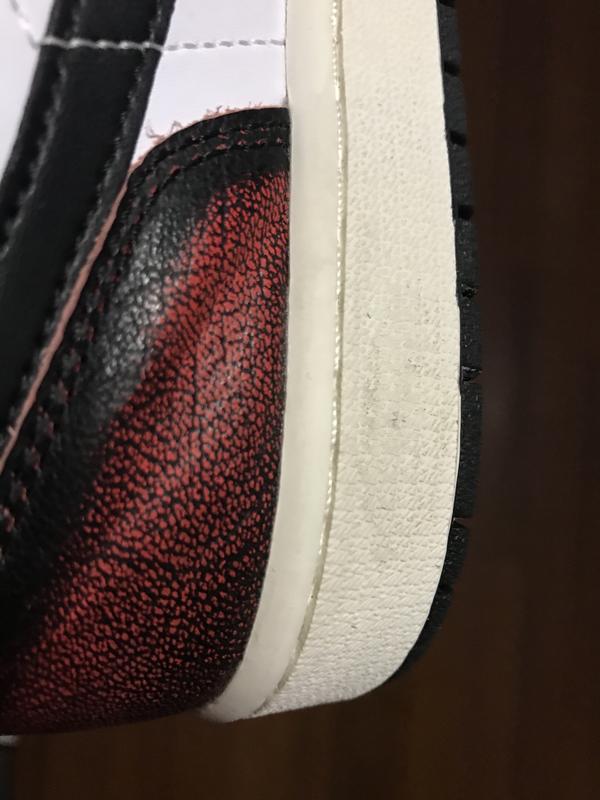 Left Shoe: Damage to the inner heel (heavy creasing / wrinkles)