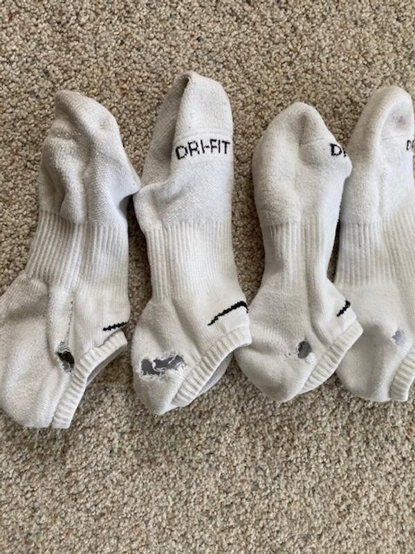 a few of the latest - current - improperly manufactured in Asia - Poor Quality White socks
