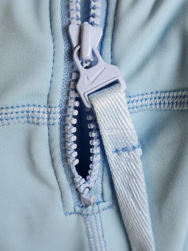 Broken zipper and blown seam in sleeve that needed to be mended.