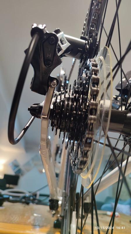 Bended derailleur adapter, making it hit the wheel