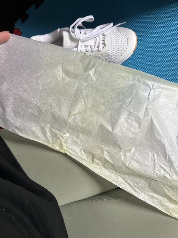 Yellow stains on shoe and on paper
