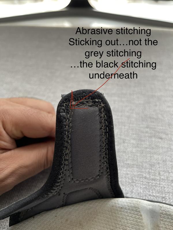 Abrasive black stitching sticking out (not visible) breaks the skin after a few minutes