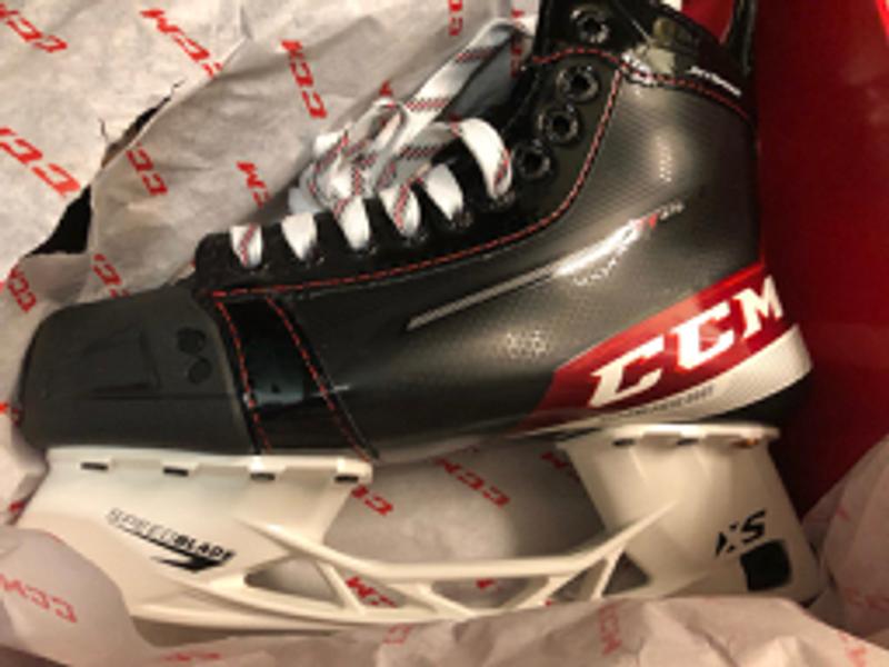 'One-Piece-Boot' wording moved-to wider white-stripe set-below a modified CCM-heel logo; 'scuff-bumper' facings, border toe-cap