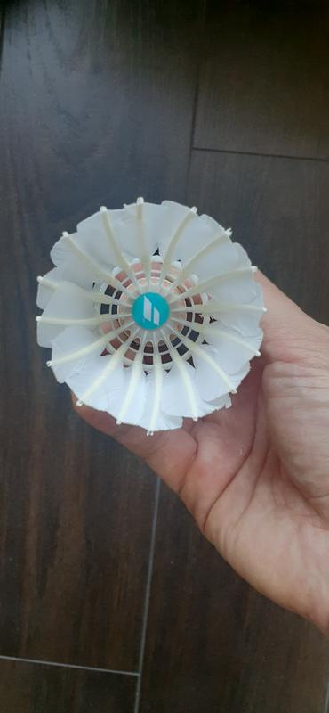 Not full feather. Only the skirt (the top half of the shuttle) is made of feather. The bottom half is made of plastic. See photos.