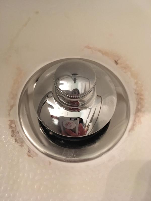 Can someone help with what I assume is a very simple question? Tub drain  stopper replacement screws too big - this hole is smaller than 5/16” screw  size; can't find any stopper