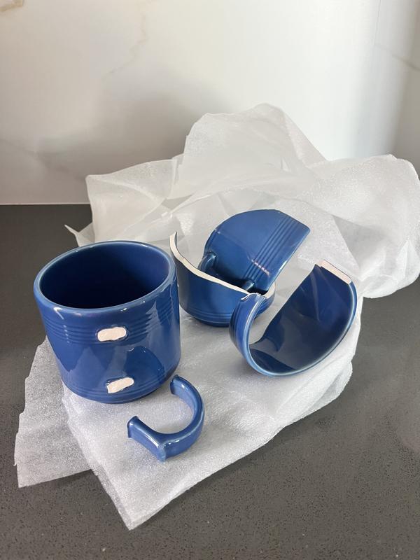 2 broken mugs