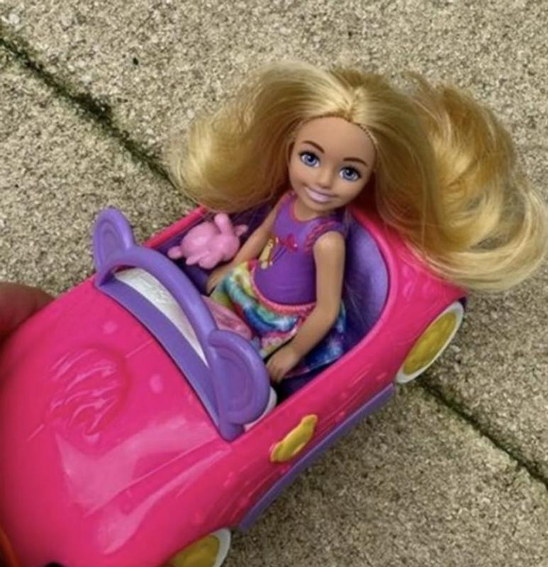 Chelsea just cruising down the sidewalk with her teddy.