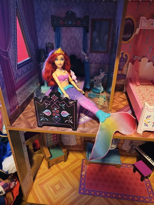 my daughter playing with Ariel in the doll house