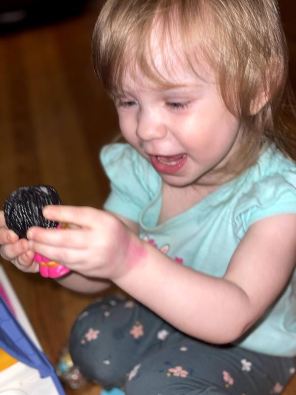 Peyton is so excited to play with her Little People characters.