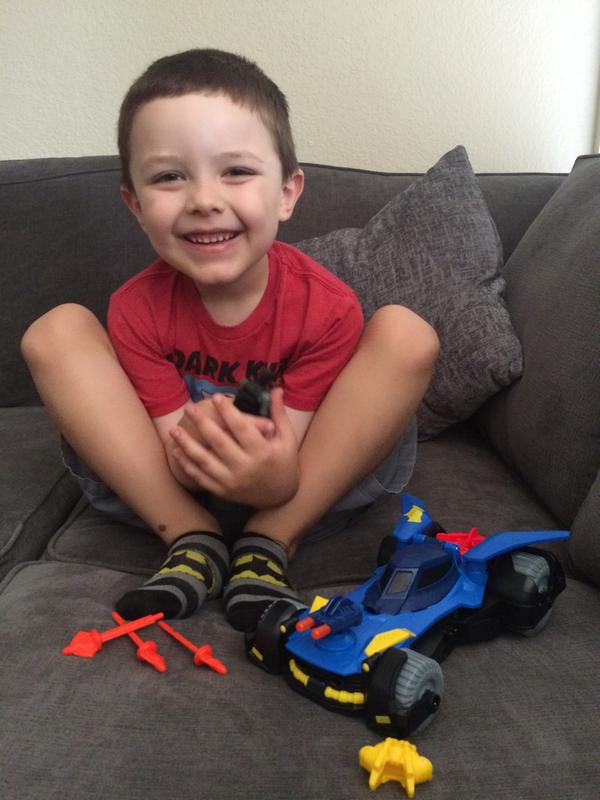 Excited about his new Imaginext DC Super Friends Batmobile!