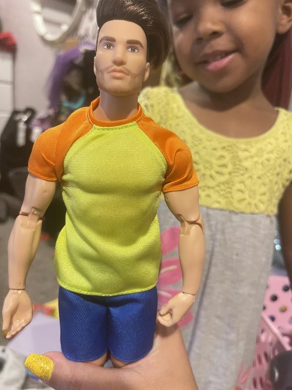 Barbie Looks Ken Doll with Brown Hair Dressed in Orange and Yellow Tee with  Blue Shorts, Posable Made to Move Body For 6 years and older