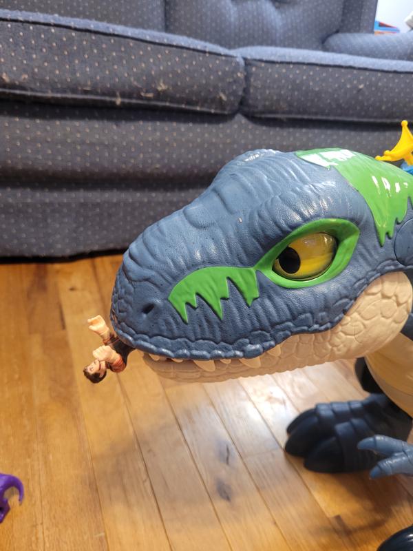 The dino's mouth can close to chomp figures.