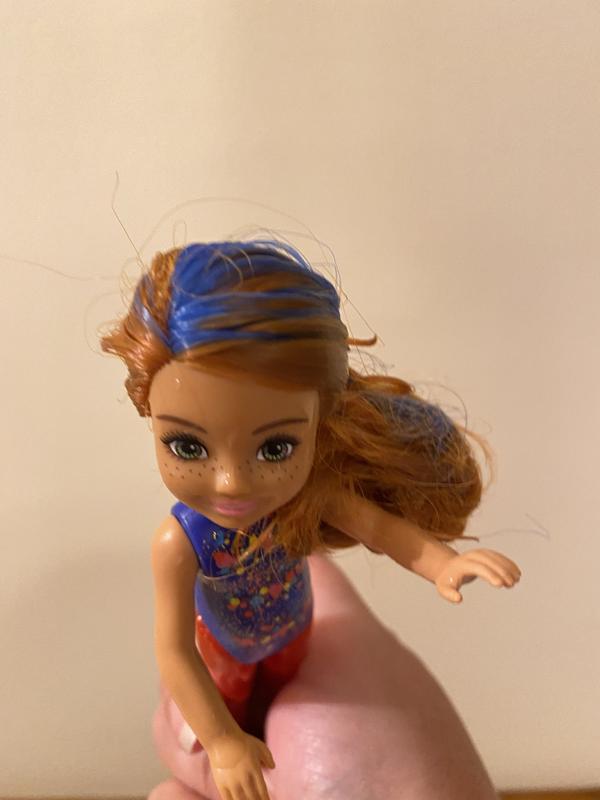 The blue in her hair got darker after adding ice to the water.