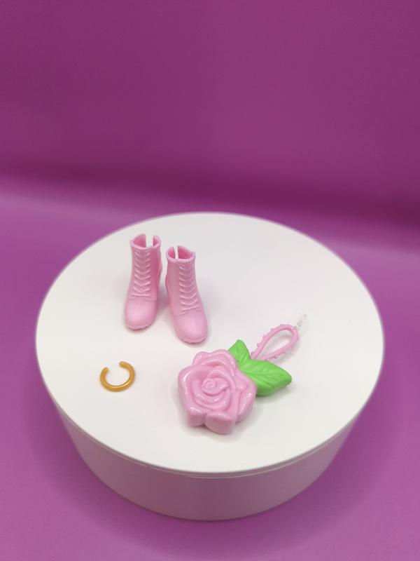 Her pink boot, gold bracelet & flower purse