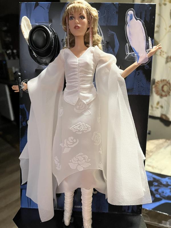 Front view of her dress it is very flowing and moves around with the doll .