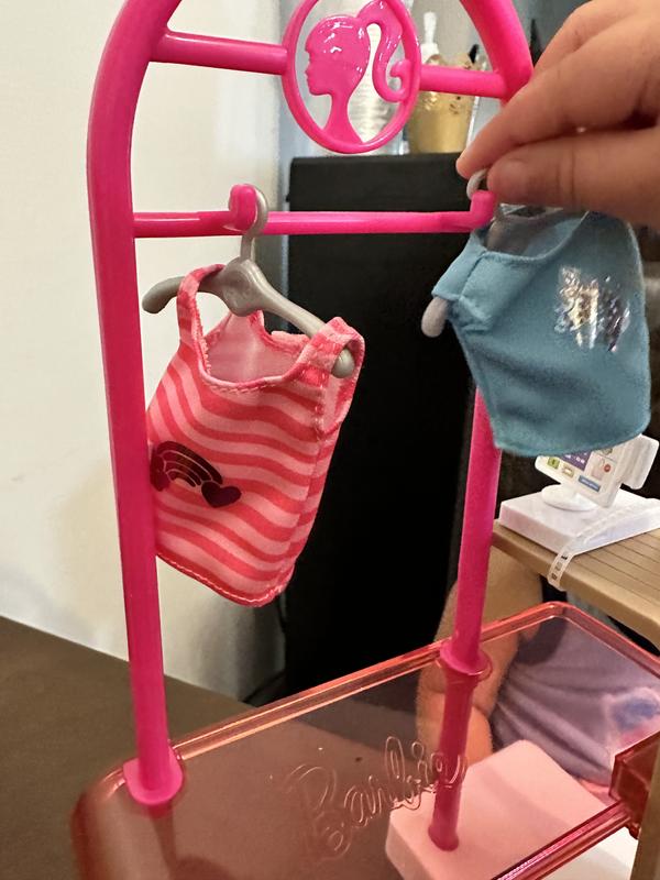 Hanging her items ready to sell