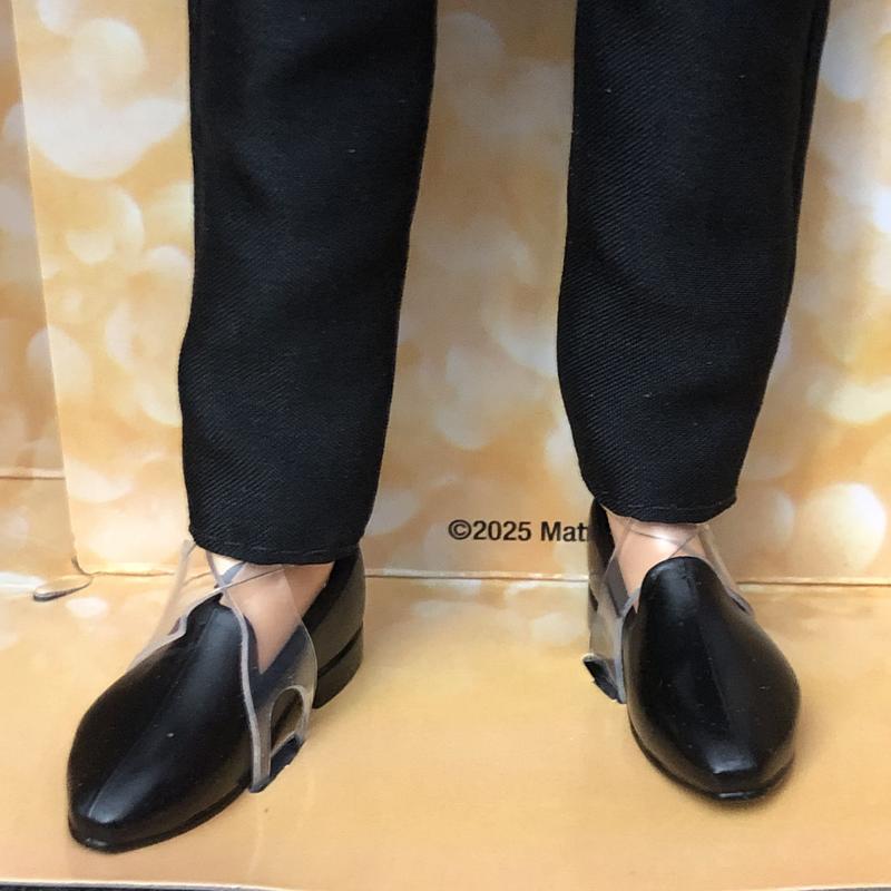 Ken is keeping his formal look casual without socks.