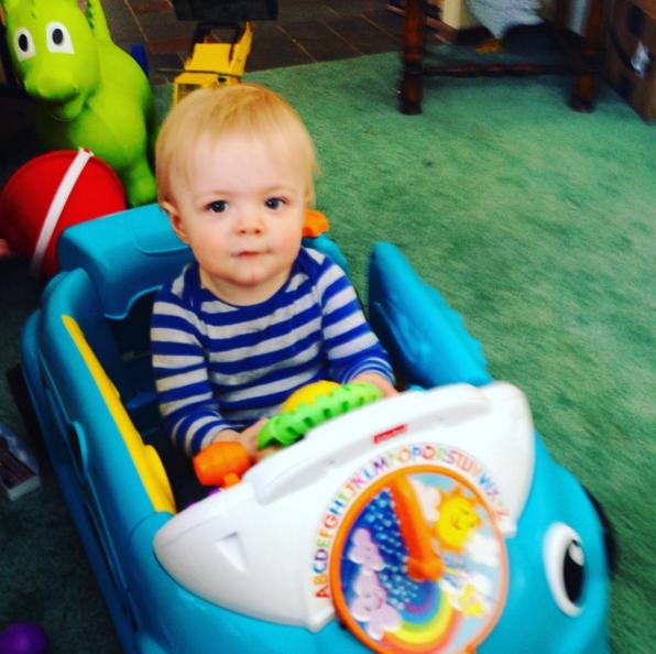 Happy boy in his car