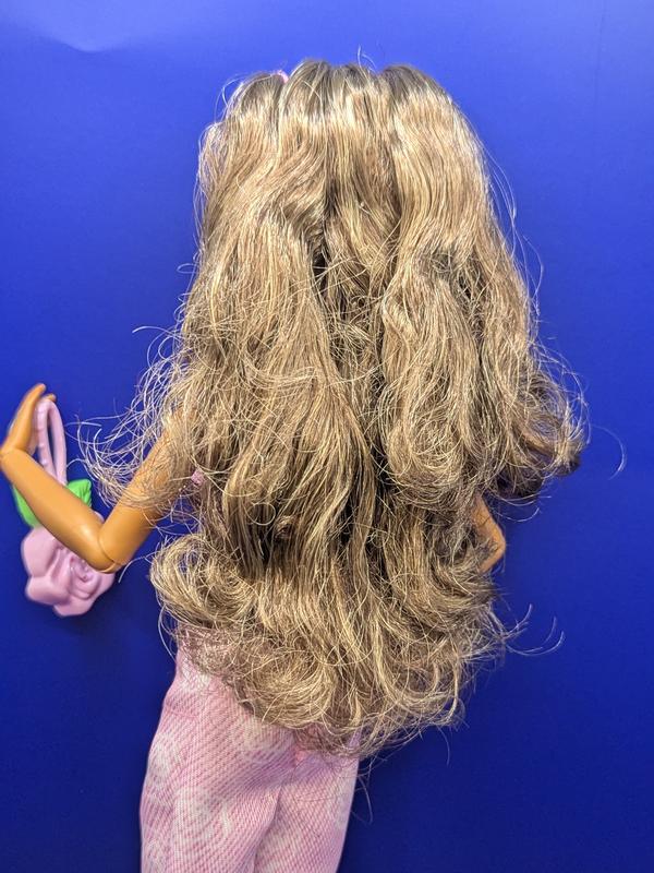 Super long hair to play with, a little messy after laying flat in the box.