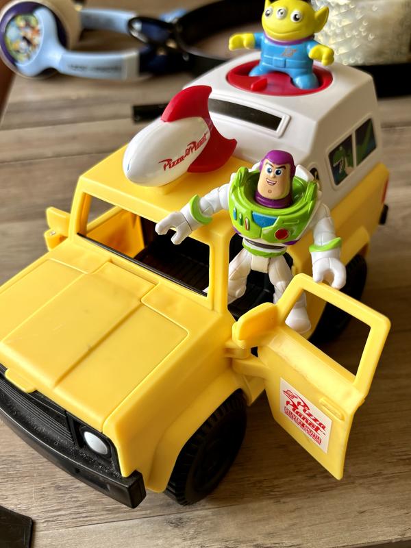 Buzz and the green alien can stand on the truck with pegs.