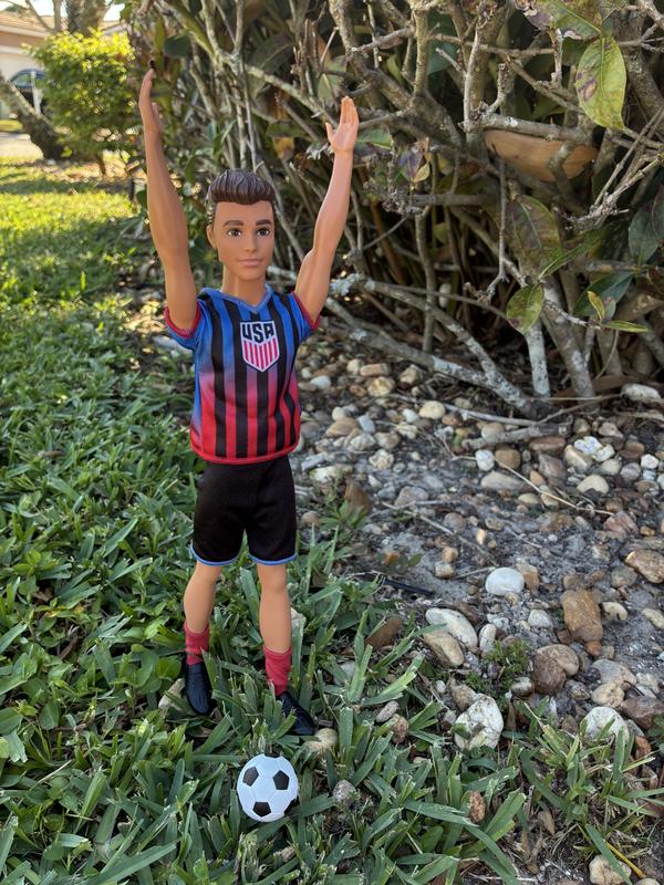 Ken’s arms raised fully upright