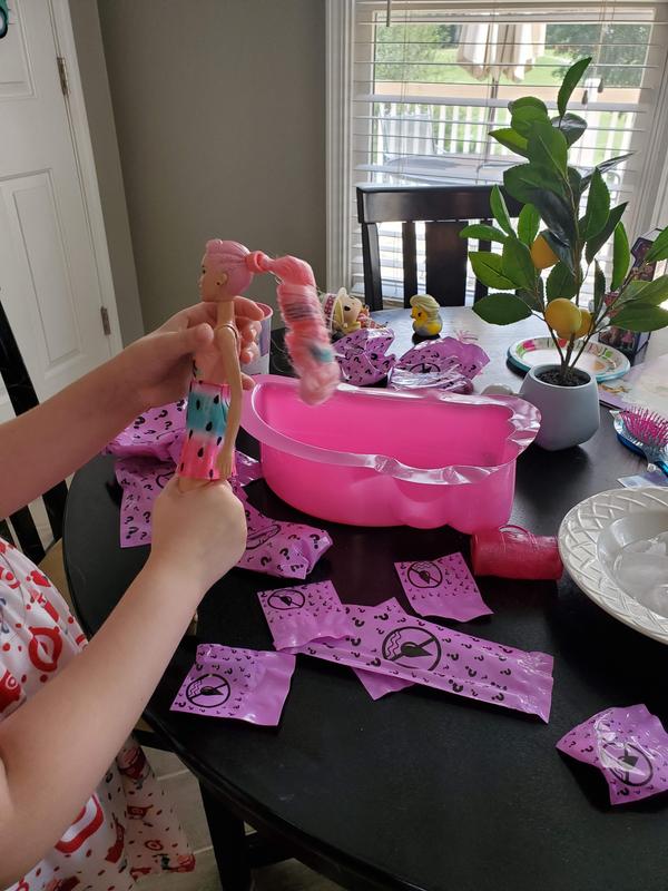 Ice water changes the white stripe in her ponytail to blue!