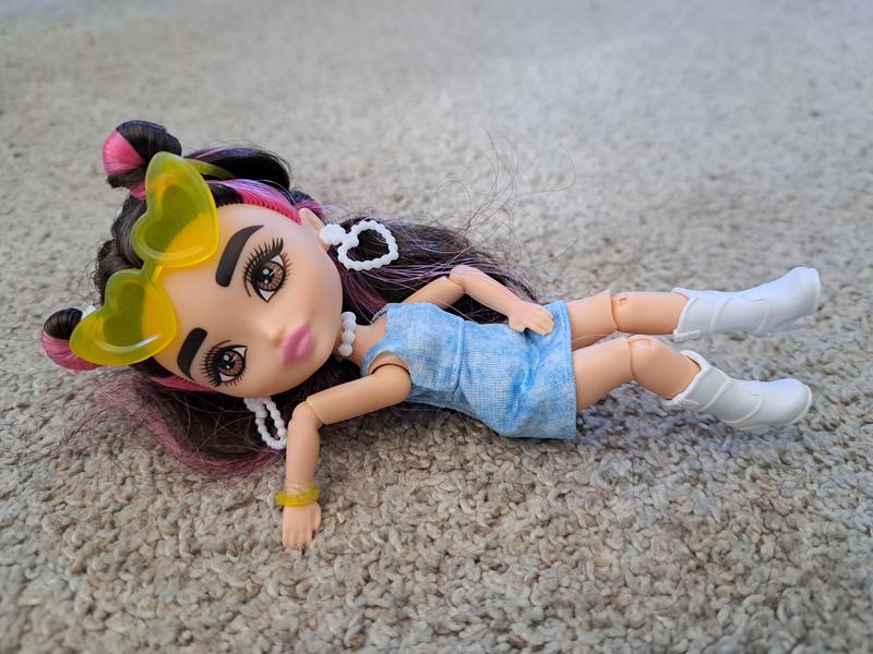 For such a small doll, the articulation is impressive. She can easily recline, sit upon a chair, and be positioned as if she's walking.