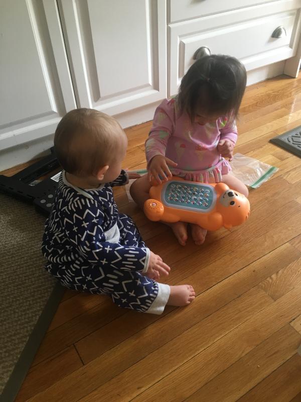 The younger kids taking turns playing