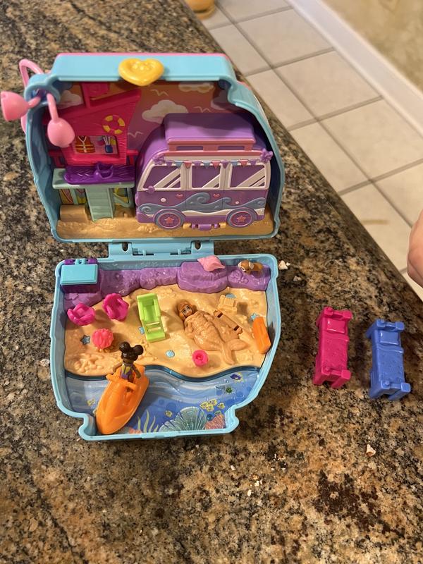 Everything included in the set. Even though there’s a dog on the outside, it’s a beach scene inside. My daughter enjoyed Polly as a sand mermaid.