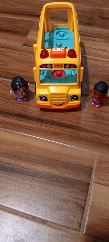 Who seems happier to go for a ride, the 2 children or the bus itself?