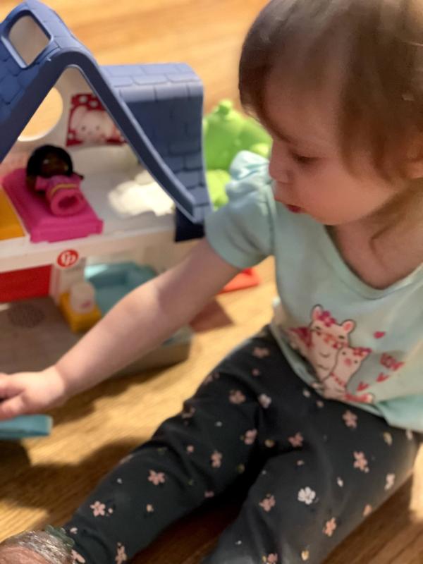 Playing with her Little People House