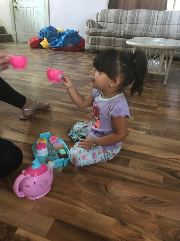 Having a cup of tea with her aunt.