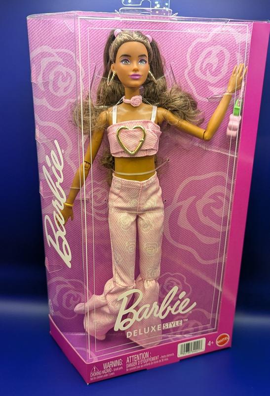 Barbie in her really cute designer box, takes about 10 mins to remove her from