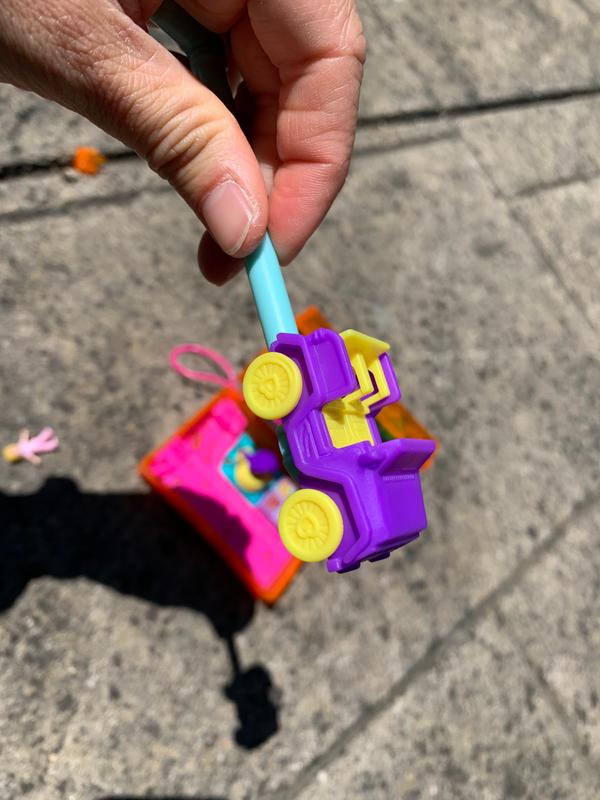 The car can be removed, and then clicked back into the play set, and the wheels really do roll!