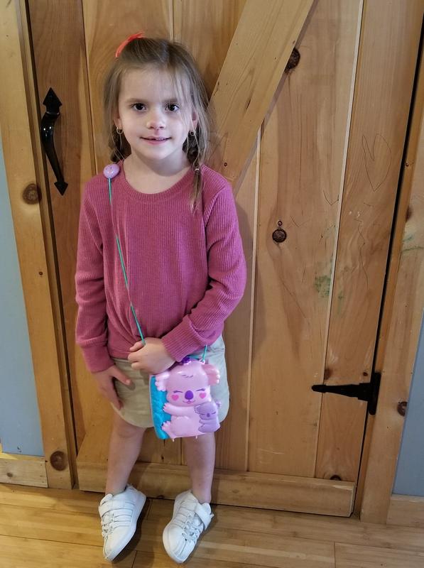 Happy five year old with her toy on the go!