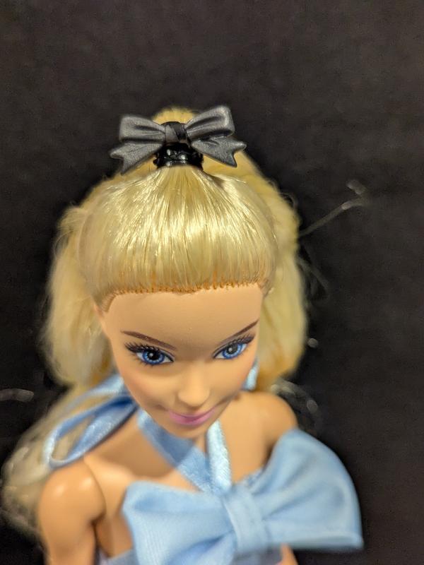 Cute hair bow accessory has a ring that wraps around a small ponytail, cannot fit on a bigger ponytail with more hair though. Can also be used as a bracelet.