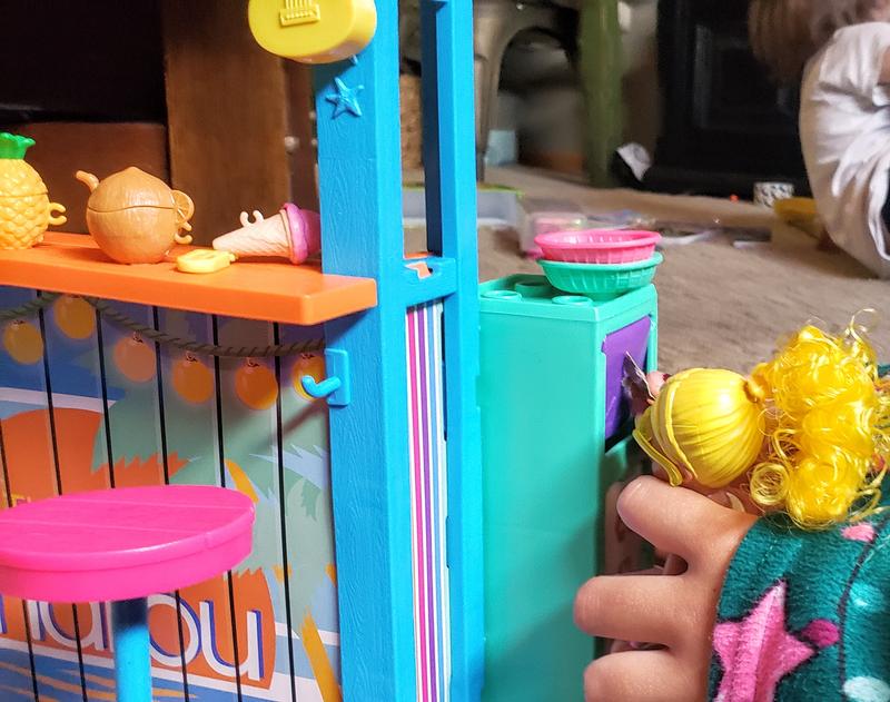 Chelsea using the recycle can! Items fall out to the floor under the can!