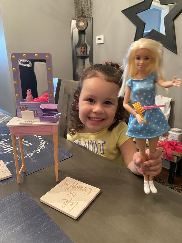 Happy girl with her new Barbie