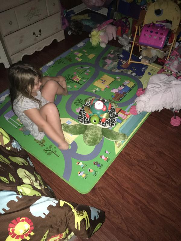 Introducing her toy to friends