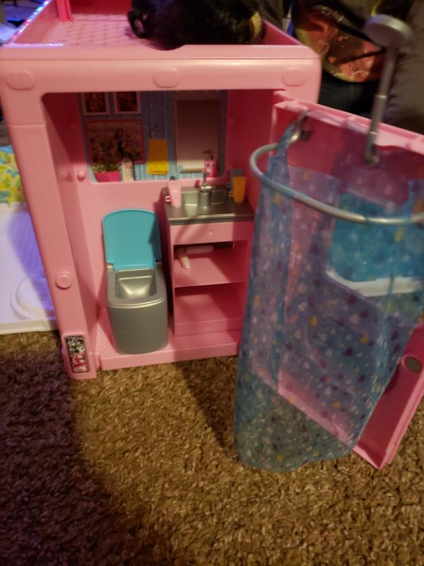 The back of camper opens up for bathroom/ shower