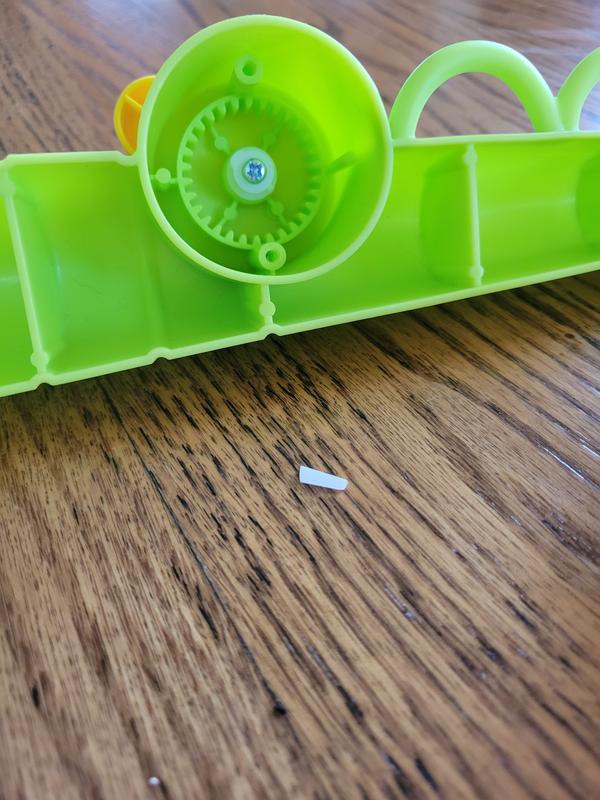 Broken plastic piece from fishing pole.