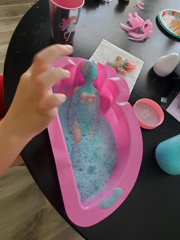 The bubble solution is working to reveal the surprise!