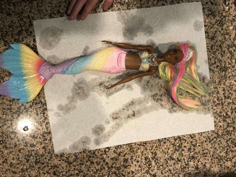 How she looks after color change in warm water.