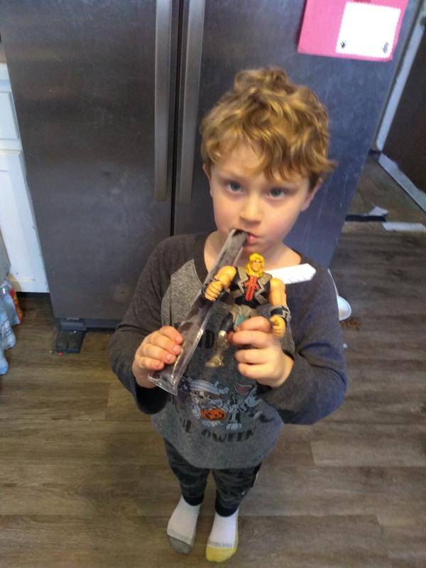 My youngest taking He-Man to get a snack.