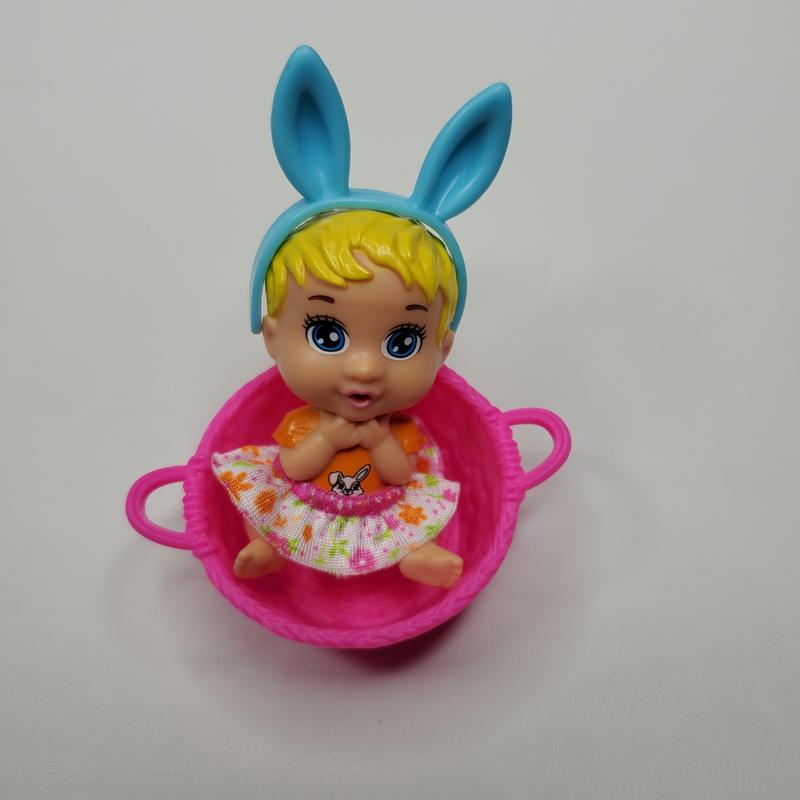 Photo of items included in the egg. (After removing the color to reveal the dool)