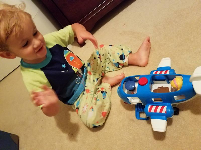 Enjoying his new Little People plane
