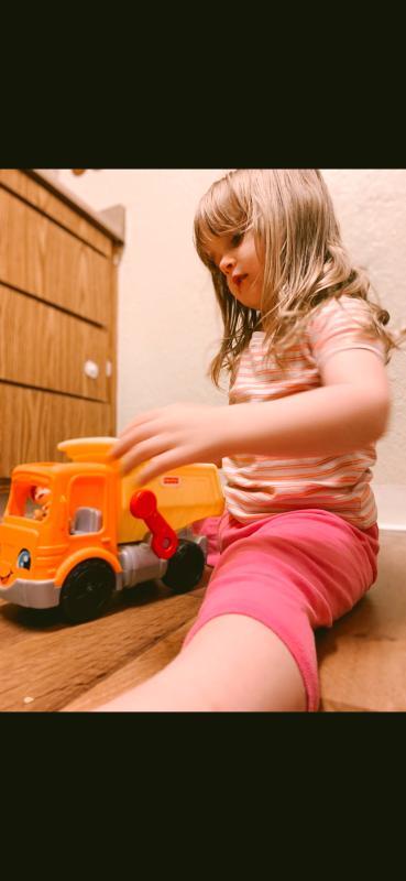 Playing with her new dump truck!