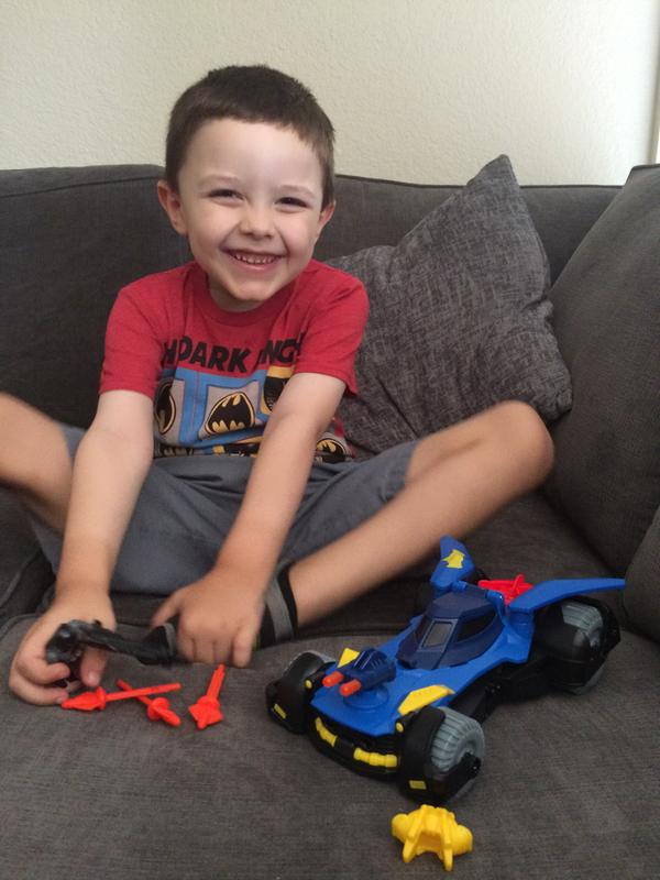Tired of photos and wanting to get to playing with his new Imaginext DC Super Friends Batmobile!