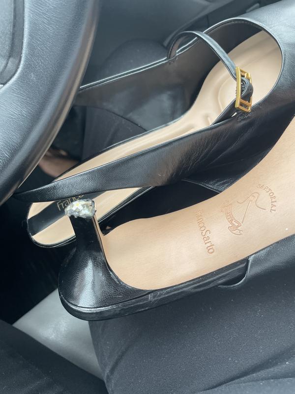 Sitting in the car with my torn up shoe!