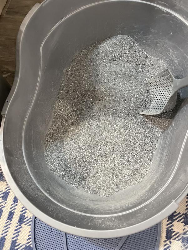 New dark gray dusty formula poured into top of litter box compared to previous formula!